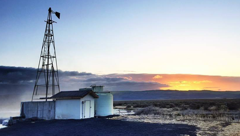 SUNSET WITH WINDMILL AND FARM BUILDINGS